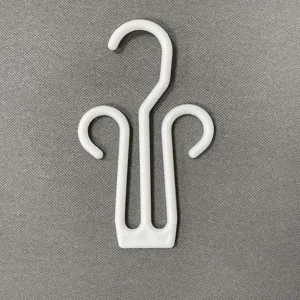 White plastic flip flop shoe hook display hanger for sandals and slippers retail store use.