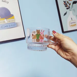 Clear glass coffee mug with cute cartoon animal print, aesthetic cup for home use.