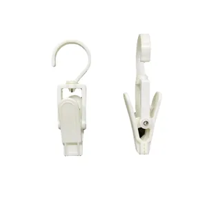Clips de gancho giratorios de plástico blanco para colgar sombreros y toallas.