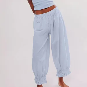 Light blue textured casual pants with elastic waist and ruffled cuffs for women detail view.
