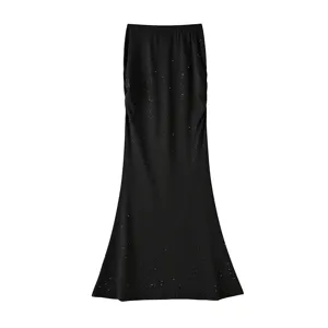Detailed view of the sparkling sequin long mermaid skirt, slim fit elegant black apparel.