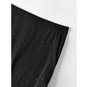 Detailed view of the black sequin slim mermaid skirt fabric, showing the glittery texture.