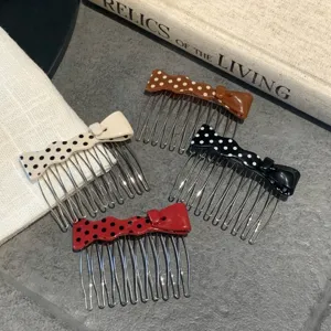 Detailed view of sweet polka dot bow hair combs in four colors with acetate finish