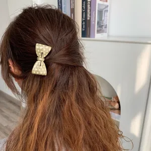 Sweet polka dot acetate bow hair clip for elegant hairstyling and securing loose hair