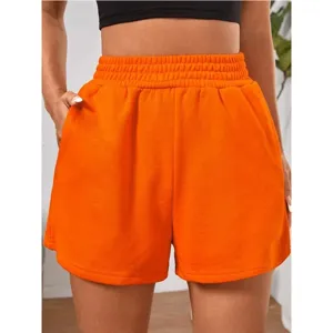 Detailed view of women's bright orange elastic high waist loose wide leg casual sports shorts