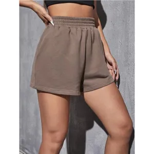 Close-up of brown elastic high-waisted loose wide-leg sports shorts for women