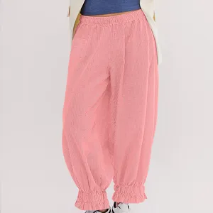 Detailed view of women casual pink loose corduroy pants with elastic ruffled waist design.