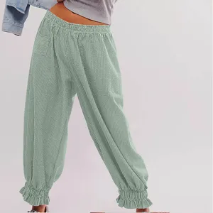Stylish women casual striped loose trousers featuring elastic waist and cute ruffled cuffs.