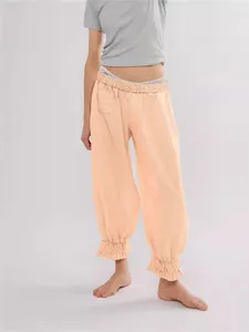 Women casual striped pants with ruffle hem and elastic high waist for summer daily wear.