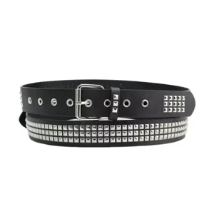 Detail view of a black punk belt with silver pyramid studs and metal eyelets
