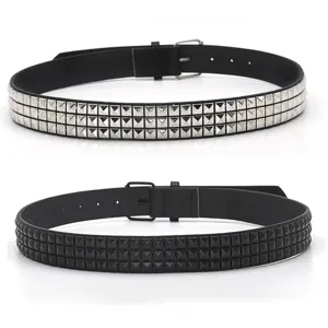 Detailed view of punk style PU leather belts with three rows of pyramid studs