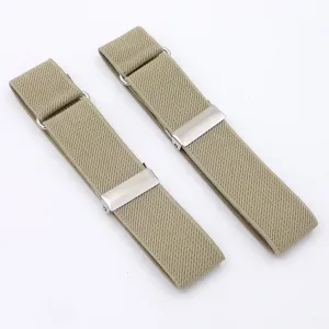 Close-up detail shot of khaki elastic shirt sleeve garters with metal adjustable clips.