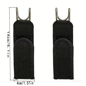 Detail shot of black hook and loop adjustable belt strap with metal buckle, close up.