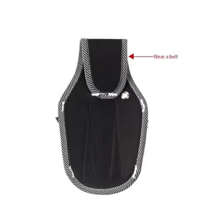 Durable black canvas tool waist bag detail showing belt loop and metal eyelet design for work.