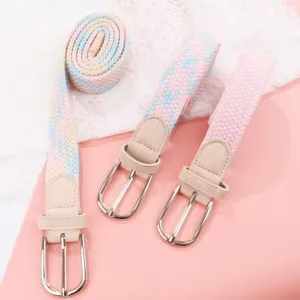 Woven belt detail showing elastic braided texture and silver buckle, perfect for casual jeans.