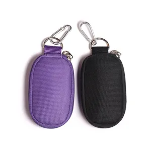 Portable small zipper storage bag with keychain, durable fabric travel pouch in purple and black.