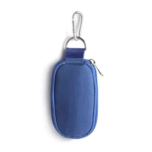 Portable blue zipper storage pouch with keychain hook, essential oil bag detail view.