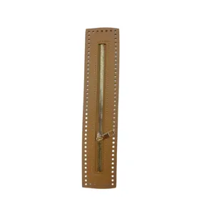 Brown PU leather zipper detail for DIY handmade bags with golden metal puller and holes.