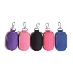 Mini oval zipper pouch keychain set detail shot, portable storage bag in multi colors.