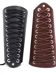 Close-up detail of punk leather bracers with cross lace-up strings and metallic eyelets.