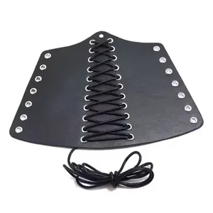 Details of black leather punk wrist cuff with metal eyelets and laced wax cord design.