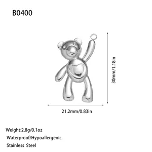 Close-up detail of stainless steel teddy bear pendant with dimensions and weight info