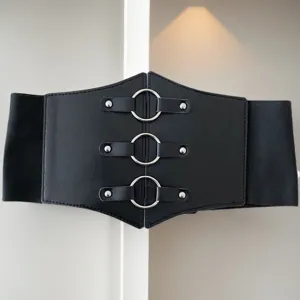 Detail view of a black wide elastic corset belt with three silver metal rings