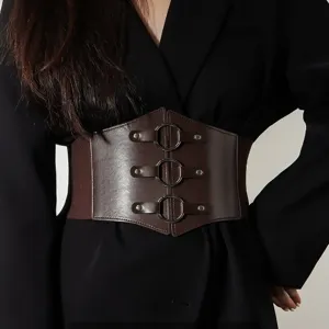 Wide brown elastic corset belt for women featuring triple metal ring buckles on PU leather