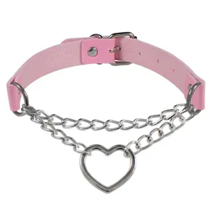 Detailed close-up of pink leather heart chain choker necklace metal ring punk style accessory