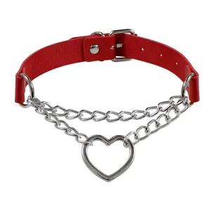 Detailed view of the red leather choker necklace featuring double silver chains and heart ring.