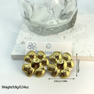 Detailed macro view of gold textured flower earrings showing size and weight specs