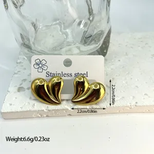 Gold-tone stainless steel heart stud earrings with a 3D vertical striped texture design.