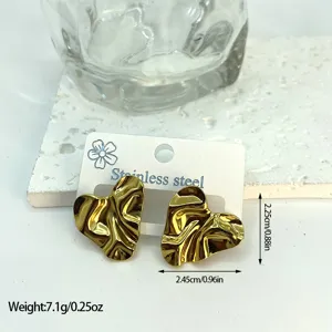 Close-up detail of geometric gold wrinkled heart stud earrings made of stainless steel