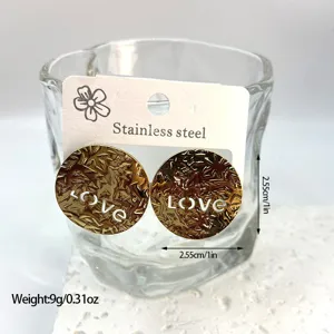 Detailed view of gold stainless steel LOVE earrings with size and weight specs