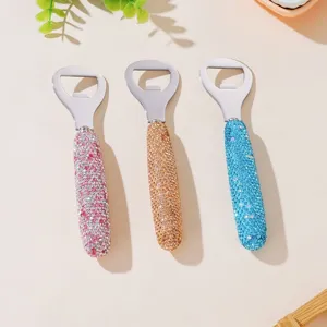 Detailed view of rhinestone stainless steel bottle openers in pink, gold, and blue