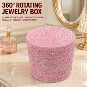 Detailed view of 4-layer rotating rhinestone jewelry box with dustproof cover on vanity.