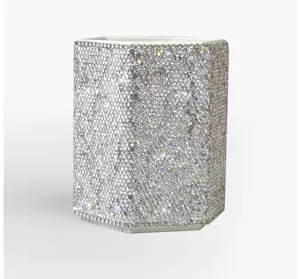 Detailed view of luxury rhinestone pen holder, sparkling silver crystal makeup organizer.