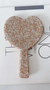 Sparkling rhinestone heart hand mirror, portable cosmetic makeup mirror for daily use.