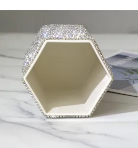 Rhinestone hexagonal desktop storage holder detail view, sparkling crystal makeup brush cup.