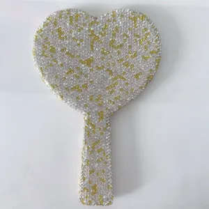 Rhinestone handheld makeup mirror detail view, heart shaped portable mirror with sparkling crystals.