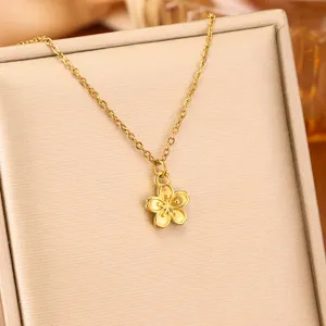 Close-up of the elegant gold cherry blossom pendant on a fine necklace chain