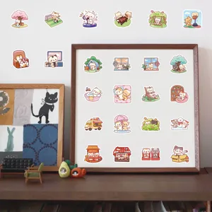 Gran variedad de pegatinas de gatos de dibujos animados en un marco de madera de pared