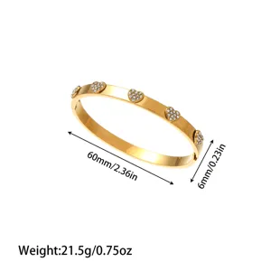 Detail view of gold heart stainless steel bangle showing dimension and weight markings
