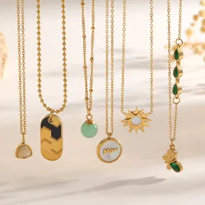 Detailed view of assorted gold-tone necklaces with shell 'Mom', butterfly, and sun pendants.