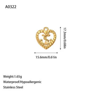 Detail view of gold heart anchor charm showing dimensions 15.6x17.3mm and 1.65g weight