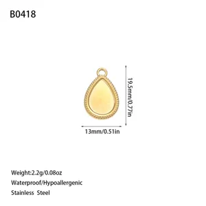 Detail view of golden stainless steel teardrop pendant with dimensions and weight info.