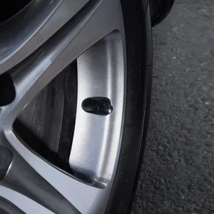 Sparkling black rhinestone car tire valve caps universal wheel stem covers crystal detail.