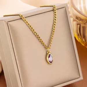 Close-up of gold titanium steel necklace with purple marquise gemstone pendant