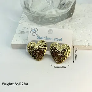 Detailed view of gold heart-shaped textured stainless steel earrings with measurements.