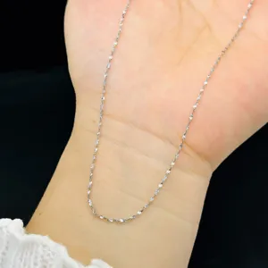Detailed view of silver titanium steel fine chain necklace texture
